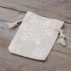 Sachets en lin imité avec l'impression 9 x 12 cm - naturelle / neige Secteurs / Emballages pour…
