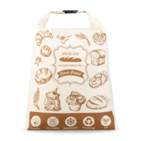 Sac à pain refermable de type roll-top avec boucle en plastique et motifs imprimés de viennoiseries et de pains.
